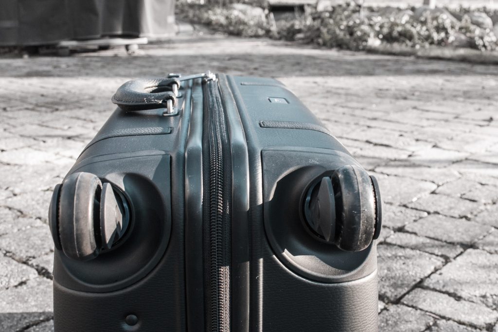 black carry-on suitcase wheels and suspension system