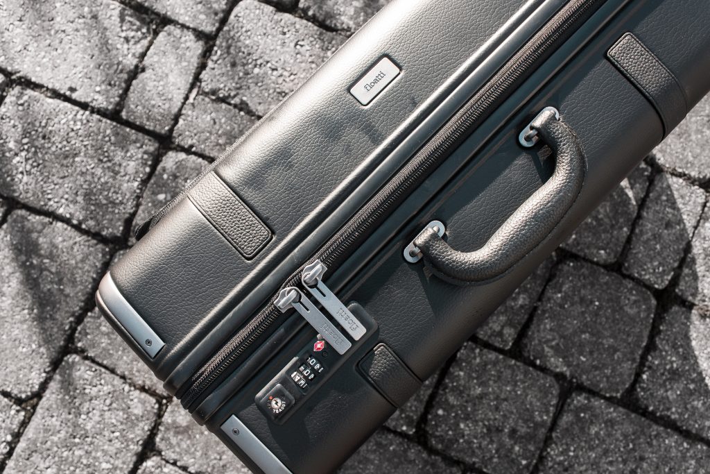 black carry-on suitcase features a double layer zipper and TSA compliant lock